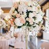 Bridal event decoration with floral arch and elegant table setting