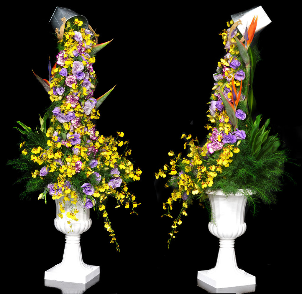 Pouring cup of flowers or pail of flowers arrangement by Flowersinmind.com